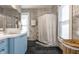 Well-lit bathroom featuring a sleek vanity and shower at 4849 Central Ave, Indianapolis, IN 46205