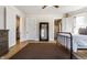 Comfortable bedroom with wood floors and a decorative full-length mirror at 4849 Central Ave, Indianapolis, IN 46205