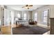 Spacious bedroom with large windows and natural light and ceiling fan at 4849 Central Ave, Indianapolis, IN 46205