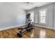 Light-filled bedroom with polished hardwood floors, and filled with natural light from two windows at 4849 Central Ave, Indianapolis, IN 46205