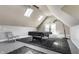 Lofted bonus space with skylights, ceiling fan, and room for entertaining at 4849 Central Ave, Indianapolis, IN 46205