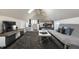 Multi-purpose bonus room featuring a tv, seating, and a foosball table for entertainment at 4849 Central Ave, Indianapolis, IN 46205