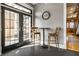 Cozy breakfast nook with French doors leading to a patio area, with seating for two at 4849 Central Ave, Indianapolis, IN 46205