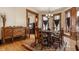 Elegant dining room with hardwood floors, classic furniture, and bright natural light at 4849 Central Ave, Indianapolis, IN 46205