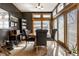 Cozy dining room featuring hardwood floors, natural light and seating for four guests at 4849 Central Ave, Indianapolis, IN 46205