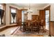 Formal dining room with hardwood floors, wooden table and chairs, with natural lighting at 4849 Central Ave, Indianapolis, IN 46205