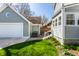 Charming home exterior with a well-maintained lawn and a convenient garage with a round accent window at 4849 Central Ave, Indianapolis, IN 46205