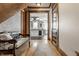 Inviting hallway that leads to a modern kitchen, beautiful hardwood floors, and custom millwork at 4849 Central Ave, Indianapolis, IN 46205
