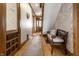 Inviting hallway with decorative wallpaper and ample natural light at 4849 Central Ave, Indianapolis, IN 46205