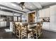 Open kitchen with stainless appliances, center island, and seating for six with bright light at 4849 Central Ave, Indianapolis, IN 46205