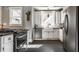 Modern kitchen features stainless steel appliances, white cabinetry, and bright natural light at 4849 Central Ave, Indianapolis, IN 46205