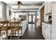 Modern kitchen features stainless steel appliances, a breakfast bar, and bright white cabinets at 4849 Central Ave, Indianapolis, IN 46205