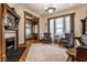 Bright living room featuring hardwood floors and a decorative fireplace at 4849 Central Ave, Indianapolis, IN 46205