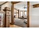 Spacious living room with hardwood floors, wood trim and decorative doorway at 4849 Central Ave, Indianapolis, IN 46205