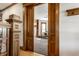 Spacious living room with hardwood floors, wood trim and decorative doorway at 4849 Central Ave, Indianapolis, IN 46205