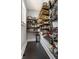 Walk-in pantry with custom shelving, providing ample storage space for food and kitchen essentials at 4849 Central Ave, Indianapolis, IN 46205