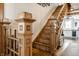 Detailed wooden staircase with decorative carvings and trim, showcasing craftsmanship and design at 4849 Central Ave, Indianapolis, IN 46205