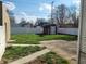 Spacious backyard with a shed, a concrete patio, grass and a privacy fence at 509 E Columbus St, Martinsville, IN 46151