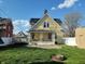 View of the backyard with a fire pit and detached shed at 509 E Columbus St, Martinsville, IN 46151