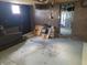 Unfinished basement featuring painted walls and ceiling, and open to utilities area at 509 E Columbus St, Martinsville, IN 46151