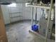 Unfinished basement with painted walls and ceilings, metal shelving, and mechanicals at 509 E Columbus St, Martinsville, IN 46151