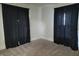 Cozy bedroom featuring dark curtains, neutral paint, and comfortable carpeting at 509 E Columbus St, Martinsville, IN 46151