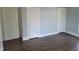 This bedroom features beautiful wood floors and ample storage with two built-in closets and a standard closet at 509 E Columbus St, Martinsville, IN 46151