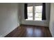 Bedroom featuring bright light from two windows and wood flooring at 509 E Columbus St, Martinsville, IN 46151