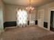 Bright dining room featuring a chandelier, built in shelving, and access to the outdoors at 509 E Columbus St, Martinsville, IN 46151