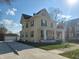 Lovely two-story yellow home with a long driveway and detached garage at 509 E Columbus St, Martinsville, IN 46151