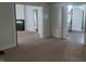 Open-concept living space with white built-in shelving and views of the staircase and fireplace at 509 E Columbus St, Martinsville, IN 46151