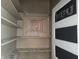 Charming pantry featuring painted shelves, bright light, and chalkboard door at 509 E Columbus St, Martinsville, IN 46151