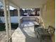 Covered back porch with seating at 509 E Columbus St, Martinsville, IN 46151