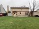 A spacious backyard featuring a patio with a pergola, ideal for outdoor living at 5814 Lakefield Dr, Indianapolis, IN 46254