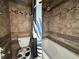 Cozy bathroom featuring a tiled shower and a toilet with modern seat design at 5814 Lakefield Dr, Indianapolis, IN 46254