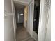 Hallway with modern flooring looking towards the front door and closet at 5814 Lakefield Dr, Indianapolis, IN 46254