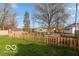 View of the spacious backyard with shed and new fence at 5838 W Henry St, Indianapolis, IN 46241