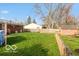 Spacious backyard with new fence, shed, and well maintained grass at 5838 W Henry St, Indianapolis, IN 46241