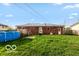 View of the home's backyard with above ground pool and access to the house at 5838 W Henry St, Indianapolis, IN 46241