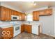 The kitchen has ample counter space and storage at 5838 W Henry St, Indianapolis, IN 46241