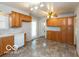 A spacious eat-in kitchen featuring ample cabinets and modern appliances with great natural light at 5838 W Henry St, Indianapolis, IN 46241