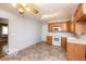 An eat-in kitchen with updated appliances and hardwood cabinets at 5838 W Henry St, Indianapolis, IN 46241