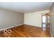 An empty living room with hardwood floors is ready for personal design and furniture at 5838 W Henry St, Indianapolis, IN 46241