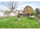 Expansive backyard with lush greenery and a lounge chair, offering a serene and relaxing outdoor space at 616 N Bancroft St, Indianapolis, IN 46201