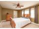 Cozy bedroom with neutral tones, natural light, and a wooden dresser for storage at 616 N Bancroft St, Indianapolis, IN 46201