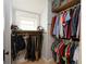 Walk-in closet featuring ample hanging space and shelving for organized storage of clothes at 616 N Bancroft St, Indianapolis, IN 46201