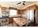 Modern kitchen featuring stainless steel appliances, granite countertops, and custom wood cabinetry at 616 N Bancroft St, Indianapolis, IN 46201