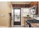 The kitchen offers backyard access and includes granite counters, stainless appliances, and a stylish range at 616 N Bancroft St, Indianapolis, IN 46201