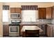 Well-equipped kitchen boasts stainless steel appliances, granite countertops, and ample cabinet space at 616 N Bancroft St, Indianapolis, IN 46201