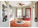 Bright living room with hardwood floors, a decorative area rug and a staircase with bench seating at 616 N Bancroft St, Indianapolis, IN 46201